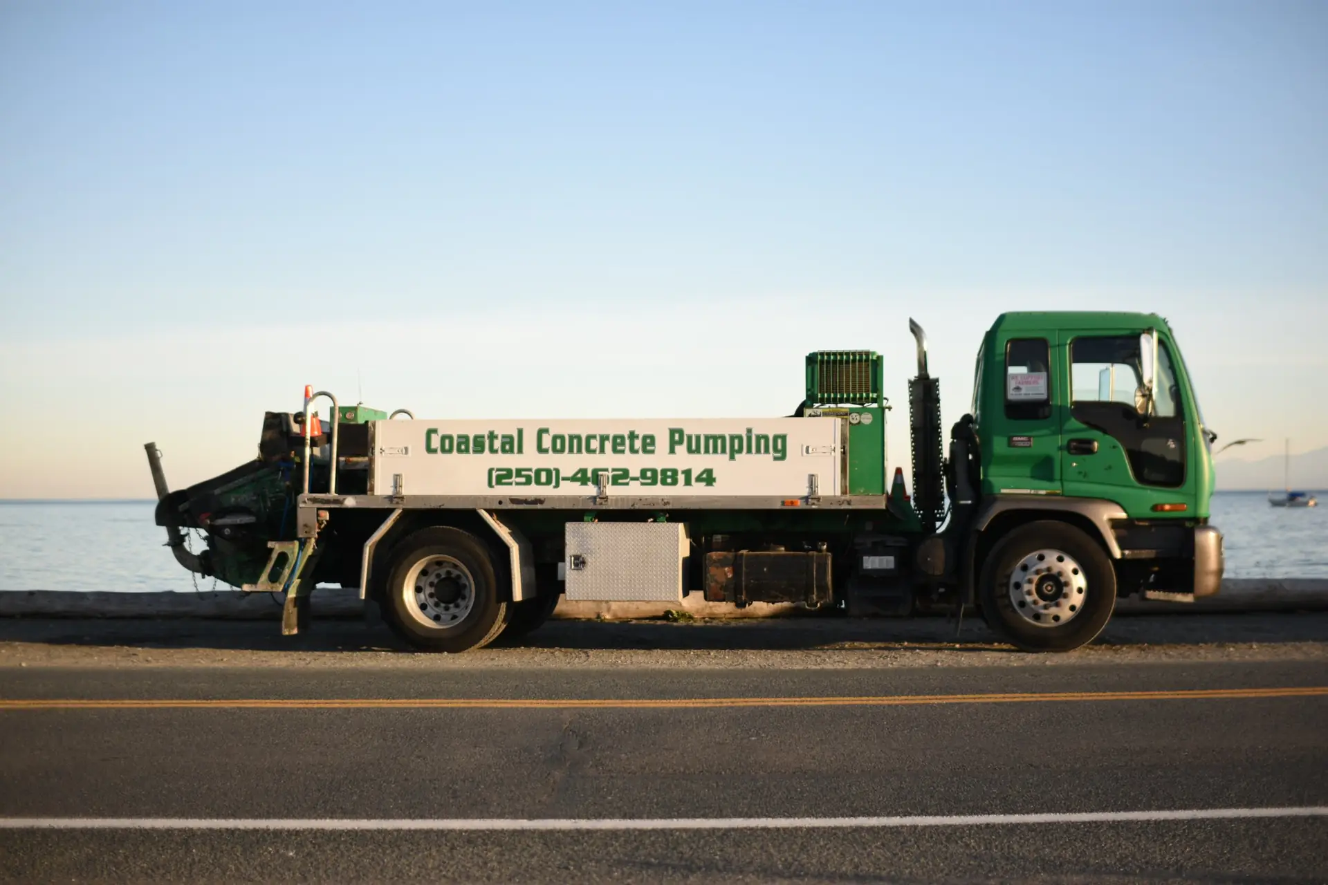 Coastal Concrete Pumping's Putzmeister line pump, mounted on a green GMC truck